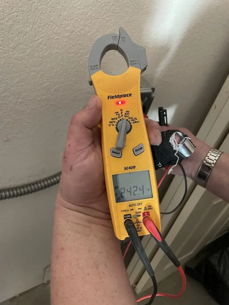 Voltage testing with clamp meter during Recessed Lighting Installation in Lodi